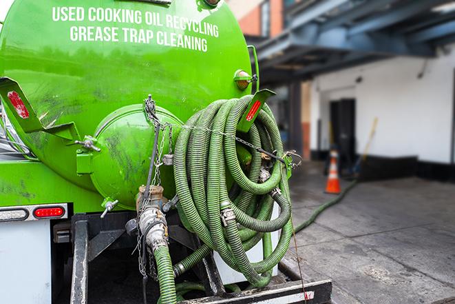 large truck pumping grease trap at a restaurant in Boca Raton, FL